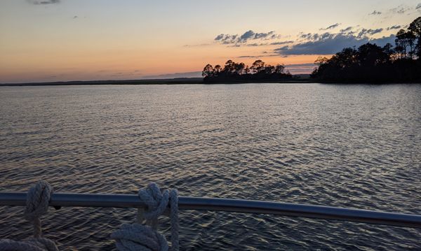 Boat at anchor at sunset