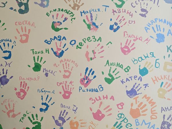 Hand prints on the wall created by the center's children.